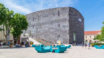 museums quartier square with people and modern art museum mumok in vienna, austria