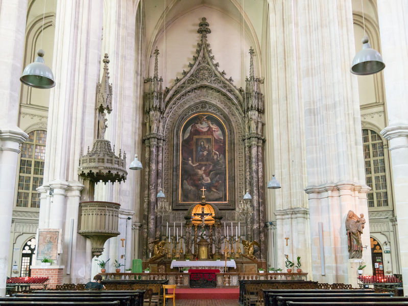 gothic interior of roman catholic minorite church with altar in historic inner city centre of vienna, austria