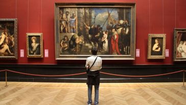 tourist admires art in museum of art history