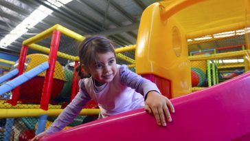 little girl play in indoor playground