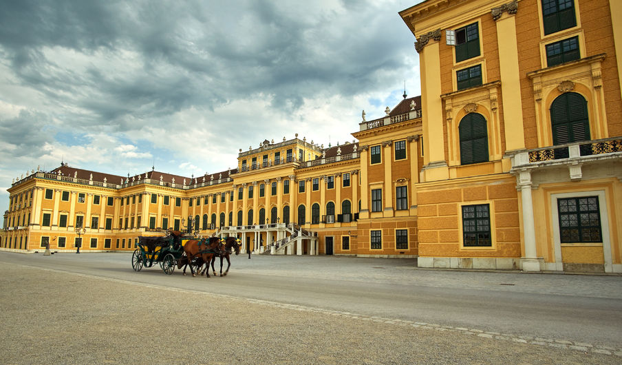 palace schönbrunn with carriage and horses